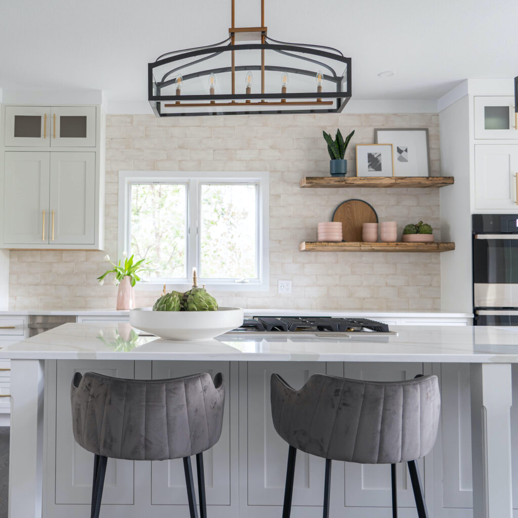 Kitchen vignette with island and grey stools